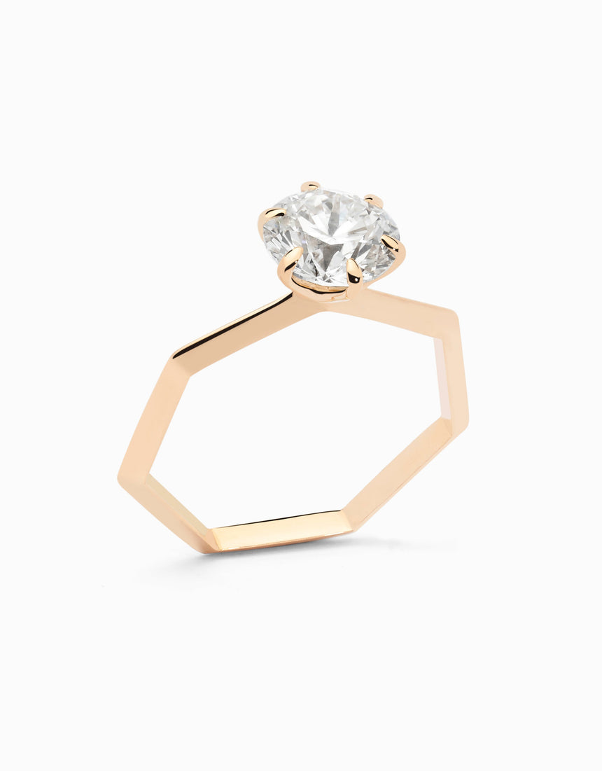 Anell solitari de compromís heptagonal amb diamant natural